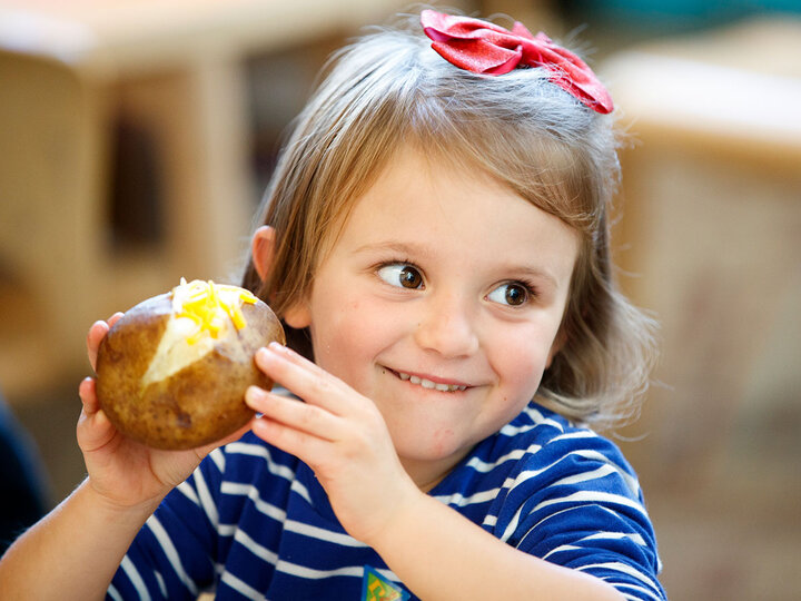 Girl with potatoe