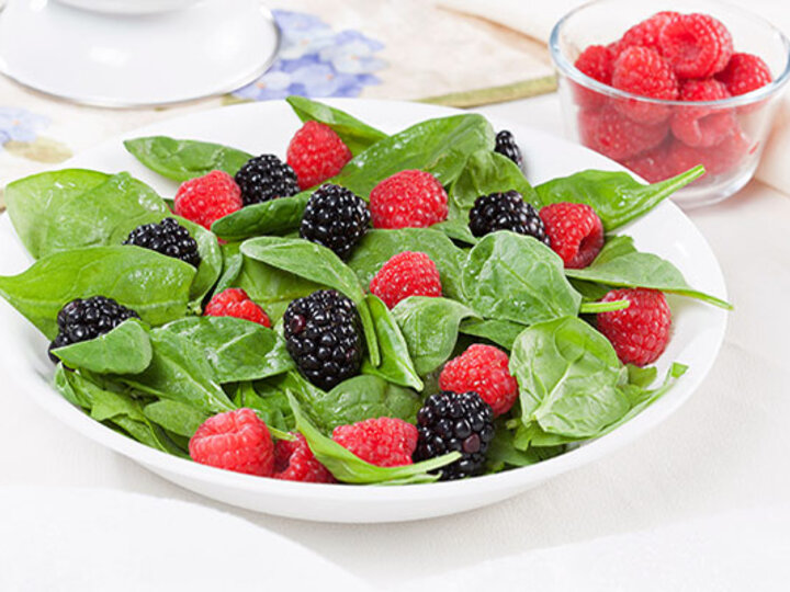 Salad with red and black berries.