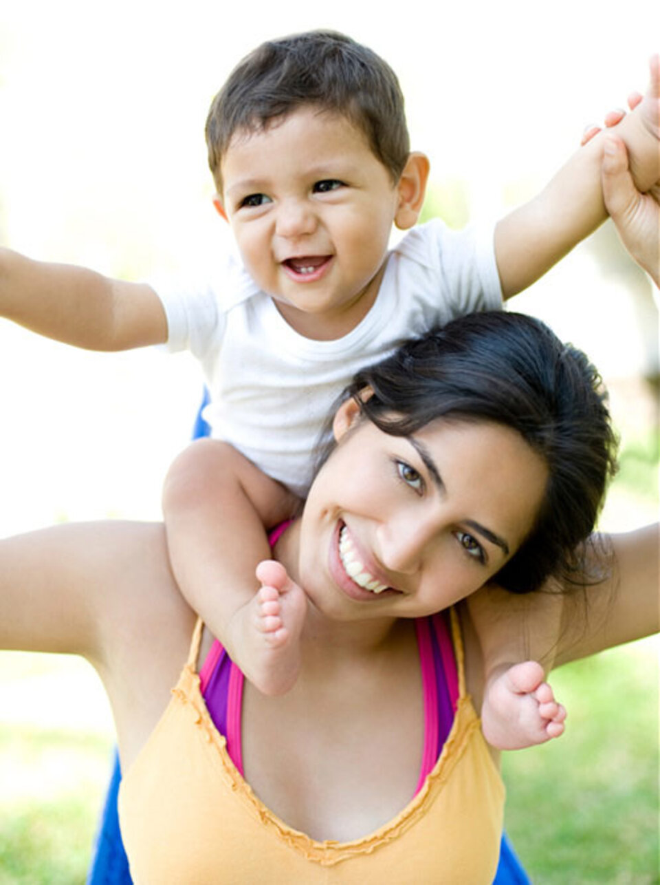 Woman with boy on shoulders.